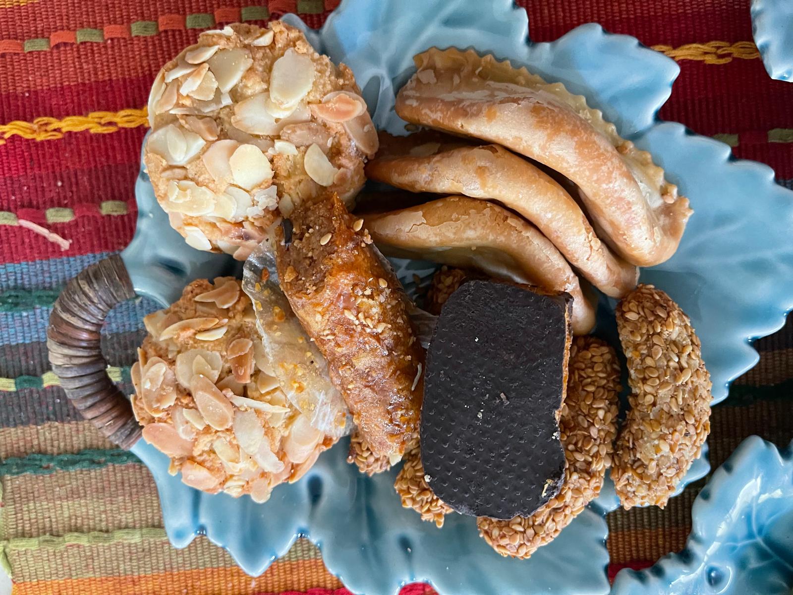 Moroccan harvest table — dates cookies nuts olives on leaf plates Austin Texas